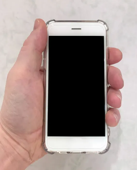 Framed Print : A hand holding a modern white touch-screen mobile smartphone with a clear case. Date: 2022 Framed Print : A hand holding a modern white touch-screen mobile smartphone with a clear case. Date: 2022