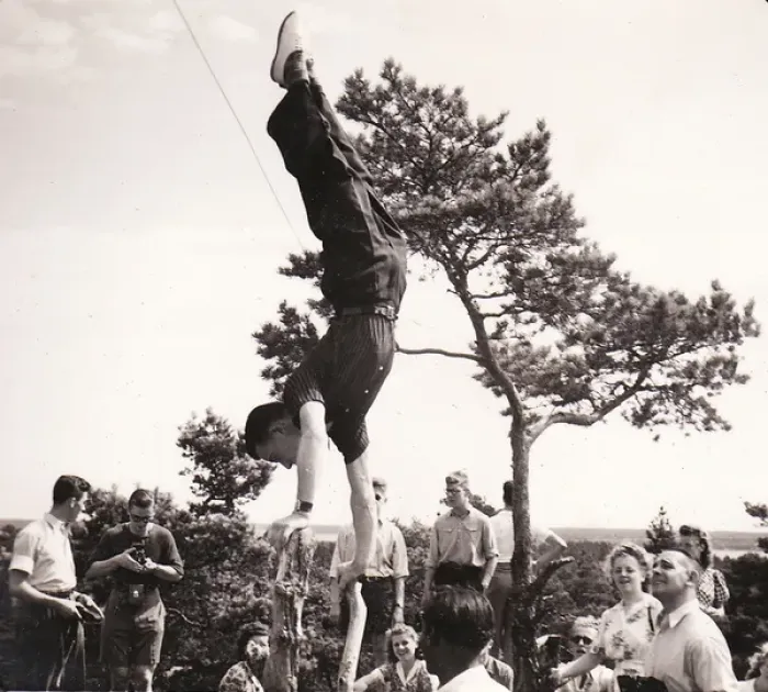 Framed Print : Handstand on tree stump with onlookers Framed Print : Handstand on tree stump with onlookers