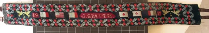 Framed Print : Handwoven belt, decorated with Allied Flags with poppies Framed Print : Handwoven belt, decorated with Allied Flags with poppies