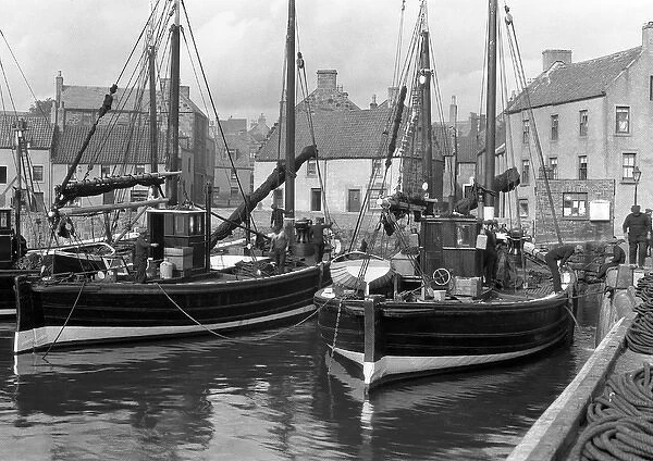 Harbour scene with fishing boats and houses, Scotland