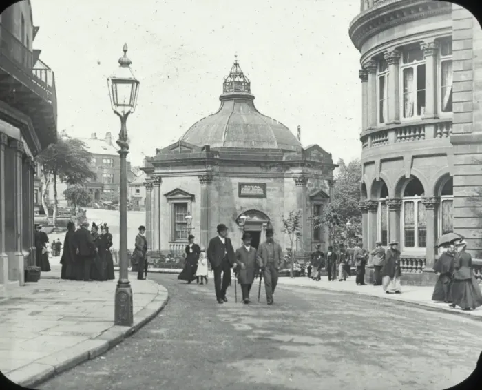 Framed Print : Harrogate - street with pedestrians, buildings on either side Framed Print : Harrogate - street with pedestrians, buildings on either side