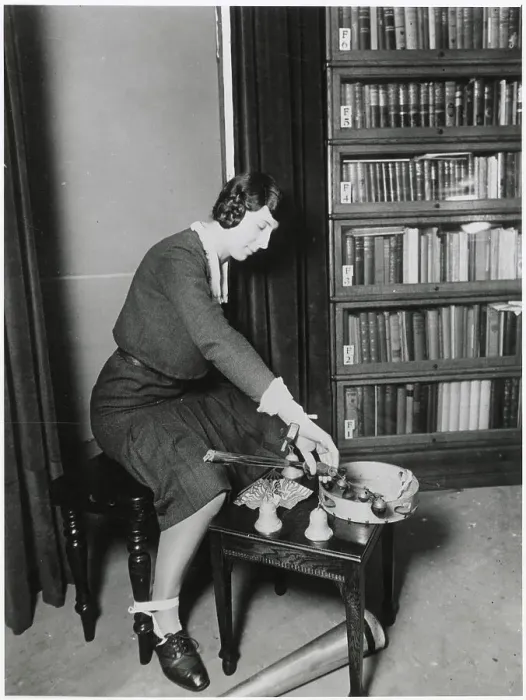 Framed Print : Harry Price's secretary, who assisted him in many of his investigations : here she is depicted with apparatus employed by fraudulent mediums. Date: early 20th century Framed Print : Harry Price's secretary, who assisted him in many of his investigations : here she is depicted with apparatus employed by fraudulent mediums. Date: early 20th century
