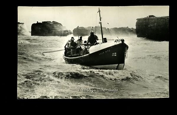 Hastings lifeboat on a rough sea, with crew on board