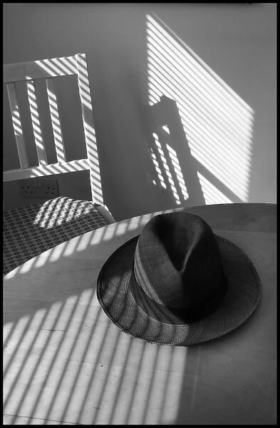 Hat and chair in the sunlight