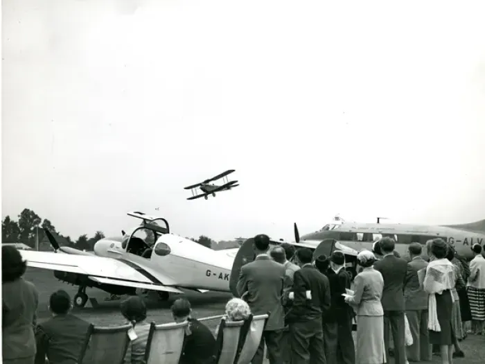 Framed Print : A de Havilland Moth flies past the de Havilland Dove, G-?