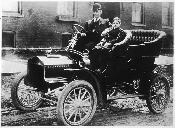 Henry Ford and son Edsel in a 1905 Ford Model F