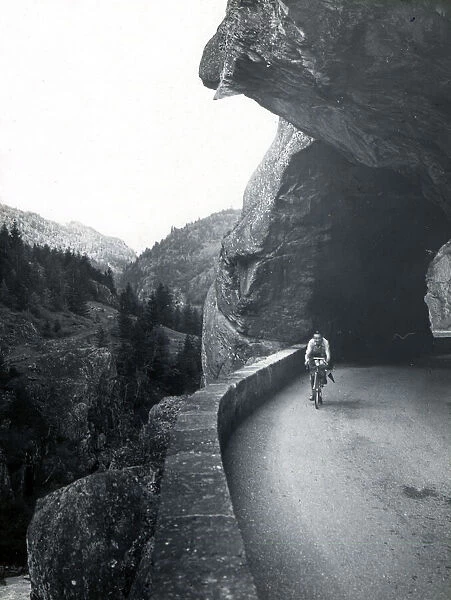 High Alpine road with rock-cut tunnel, France