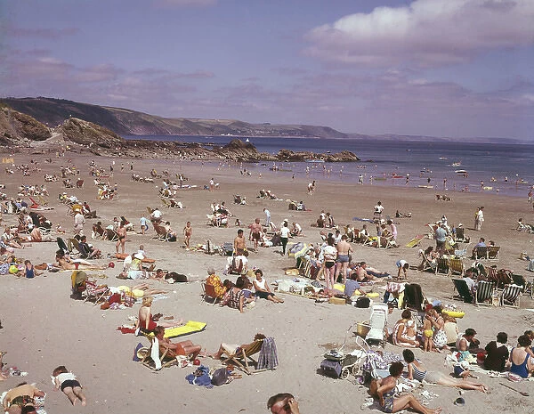 Holidaymakers on the beach at Looe, Cornwall