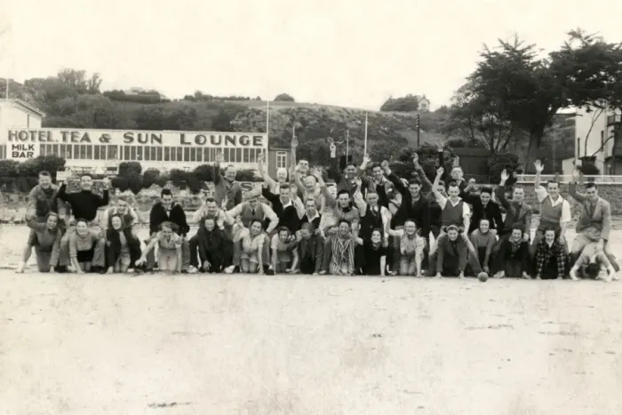 Framed Print : Holidaymakers enjoy a group photograph on the beach Framed Print : Holidaymakers enjoy a group photograph on the beach