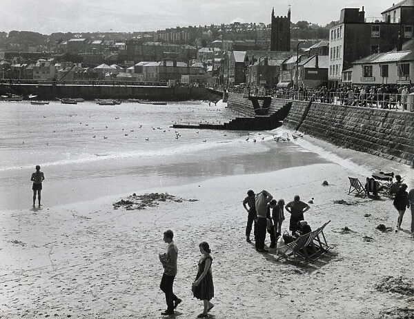 Holidaymakers on the harbour beach, St Ives, Cornwall