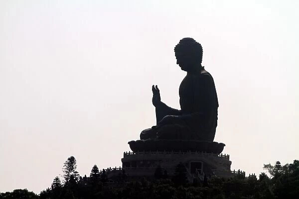 Hong Kong. Silhouette of the Tian Tan Buddha statue on Lantau Island in Hong Kong, China