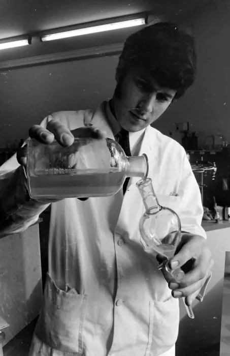 Framed Print : Horse doping tests -- a laboratory technician in a white coat pours a sample from a large Framed Print : Horse doping tests -- a laboratory technician in a white coat pours a sample from a large