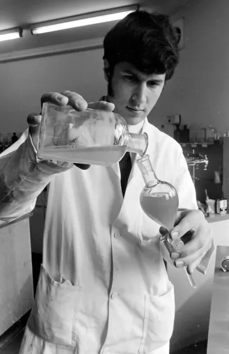 Framed Print : Horse doping tests -- a laboratory technician in a white coat pours a sample from a large Framed Print : Horse doping tests -- a laboratory technician in a white coat pours a sample from a large