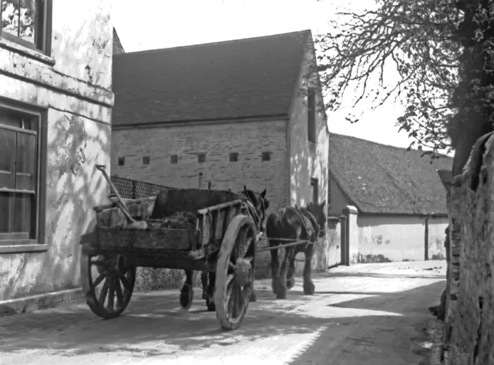 Framed Print : Horses and cart in a village