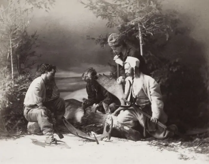 Framed Print : Hunters skinning a deer in snow, Canada Framed Print : Hunters skinning a deer in snow, Canada