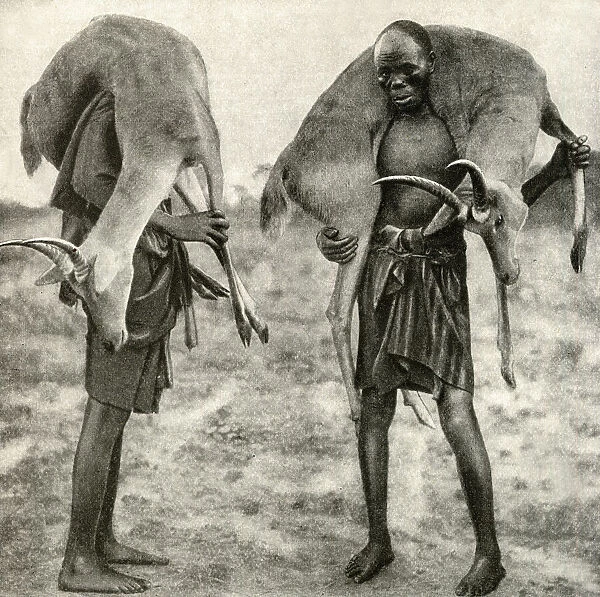 Huntsmen with game, Tanganyika, East Africa