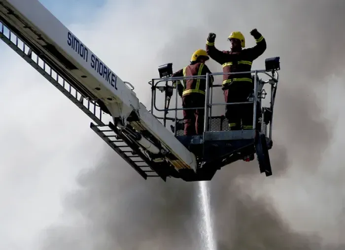 Framed Print : A hydraulic lift in action at scene of fire, Penge