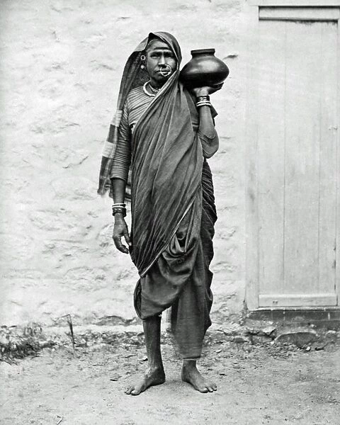 Indian woman carrying a jar