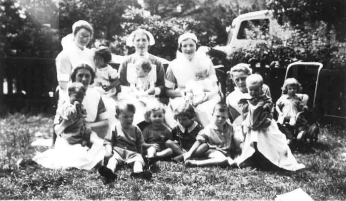 Framed Print : Informal outdoor group of nurses and children Framed Print : Informal outdoor group of nurses and children