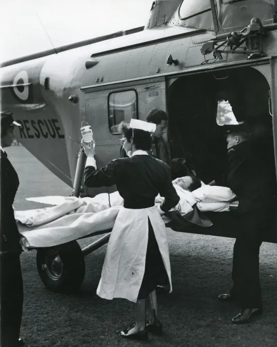 Framed Print : Injured boy loaded into a Westland Whirlwind Framed Print : Injured boy loaded into a Westland Whirlwind