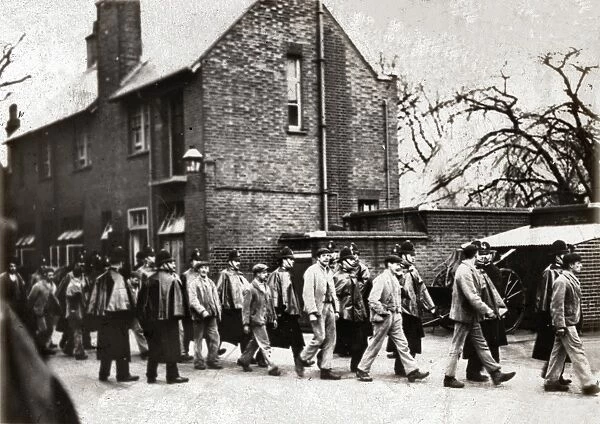 Inmates of Belmont Workhouse, Sutton, on their way to prison