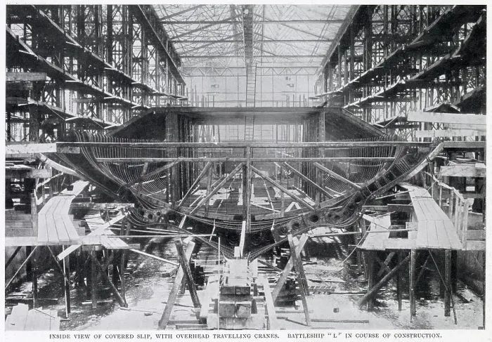 Framed Print : An inside view of a covered slip, with overhead travelling cranes at the Germania yard at Kiel, Germany. The ship being built is Battleship L'. Date: 1902 Framed Print : An inside view of a covered slip, with overhead travelling cranes at the Germania yard at Kiel, Germany. The ship being built is Battleship L'. Date: 1902