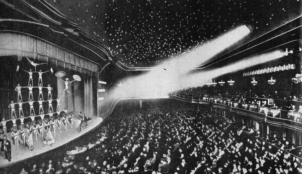 The interior of the Wintergarten Theatre, Berlin with an acrobatic routine on the stage