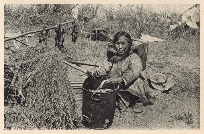Framed Print : Inuit woman preparing fish and water rats - Alaska, USA