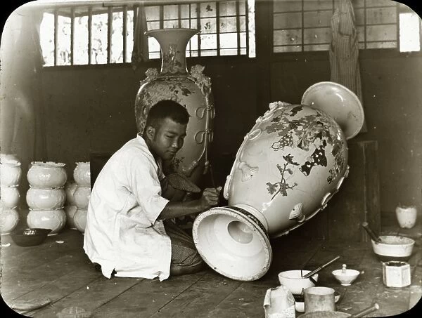 Japan - Artist painting a large Urn