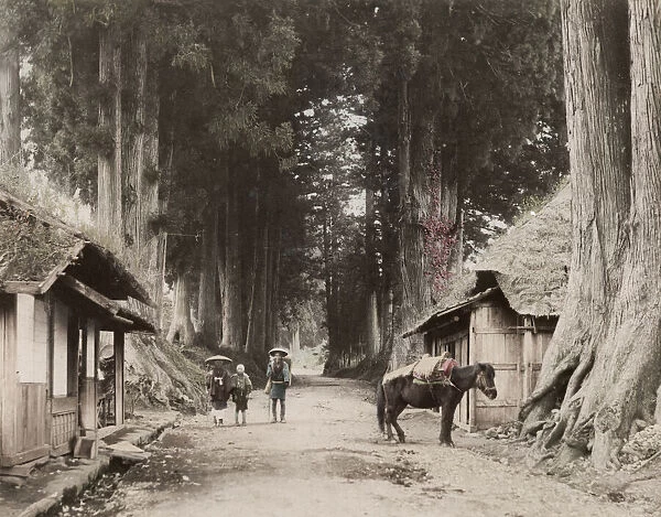 Japan: a country road with travellers and a pack pony