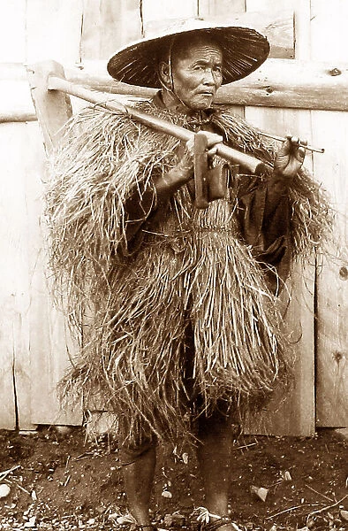 Japan - farmer wearing a raincoat early 1900s