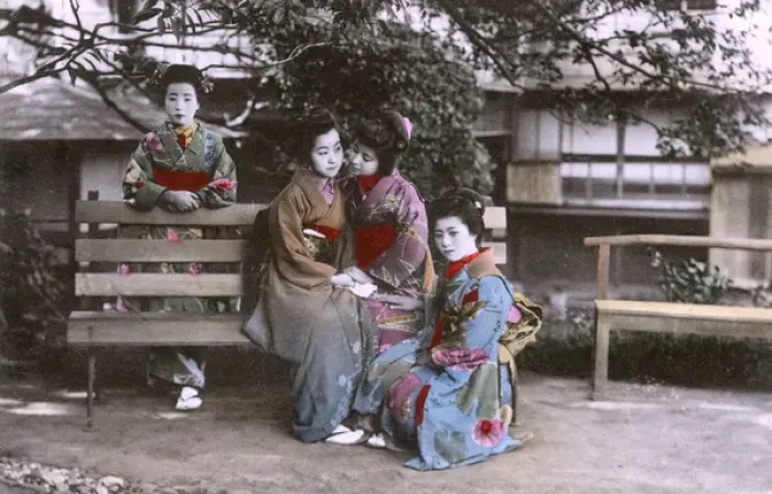 Framed Print : Japan - Four Geisha pose for the photographer around a bench Framed Print : Japan - Four Geisha pose for the photographer around a bench