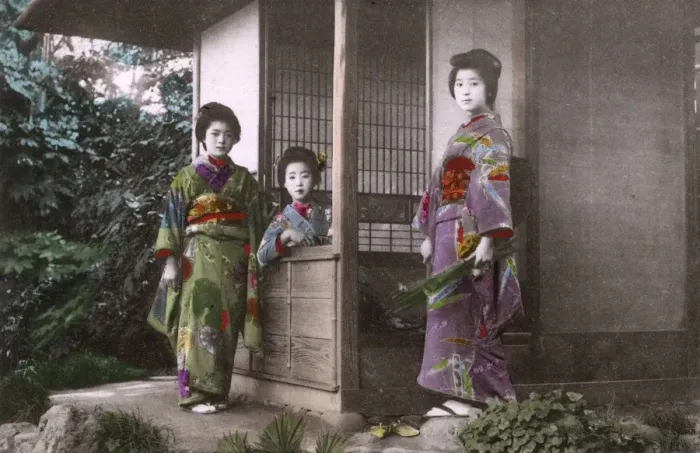 Framed Print : Japan - Three Geisha pose for the photographer by a house Framed Print : Japan - Three Geisha pose for the photographer by a house