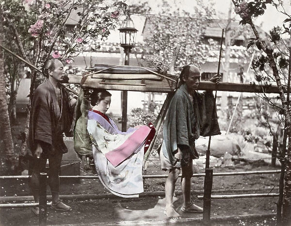Japan - woman with porters in a kago or carrying chair
