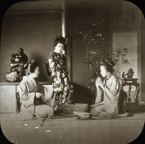 Japan - Three women next to a wooden box