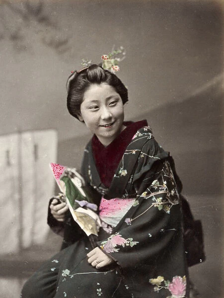 Japan - young woman in ornate kimono, smiling