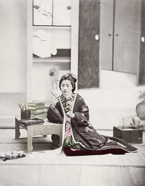 Japan - young woman writing on a scroll
