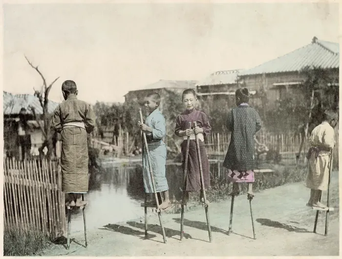 Framed Print : Japanese boys playing on bamboo stilts (bamboo horse) Date: circa 1890s Framed Print : Japanese boys playing on bamboo stilts (bamboo horse) Date: circa 1890s