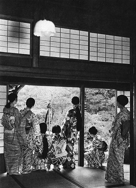 Japanese family group - different styles of kimono and hair