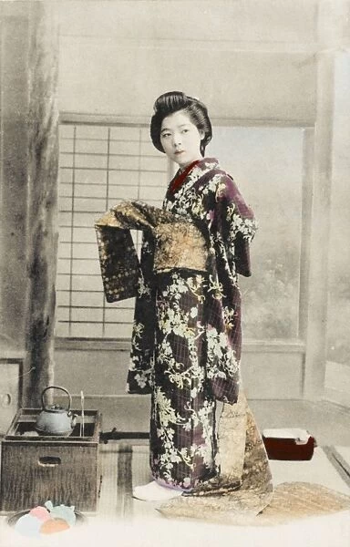 Japanese Geisha girl getting dressed