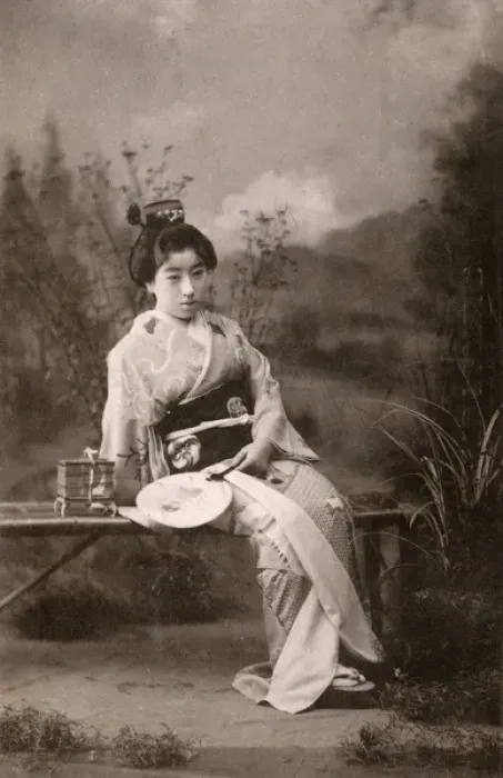 Framed Print : A Japanese Geisha posing in a studio garden setting Framed Print : A Japanese Geisha posing in a studio garden setting