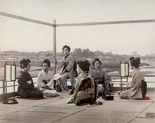 Japanese geishas on a tea house balcony, Kyoto