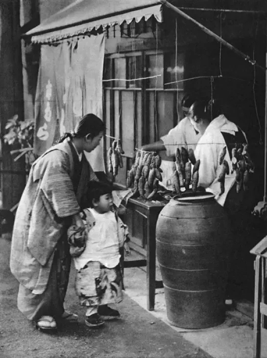 Framed Print : A Japanese mother and child look at a food stall Framed Print : A Japanese mother and child look at a food stall