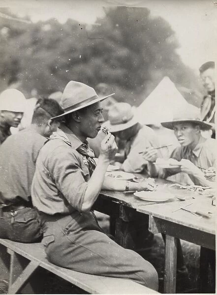 Japanese scouts eating at camp