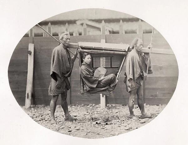 Japanese woman in a kago, carrying chair, Japan, c. 1870 s