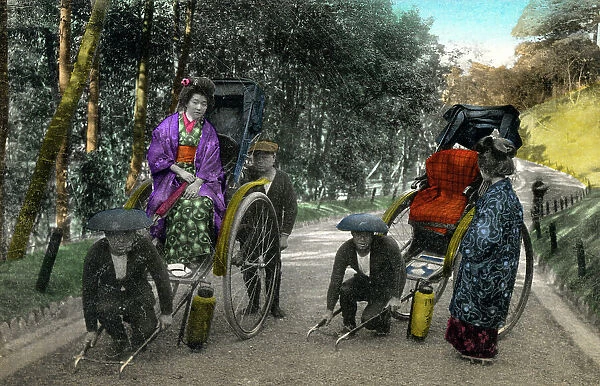 Two Japanese women get into their rickshaws