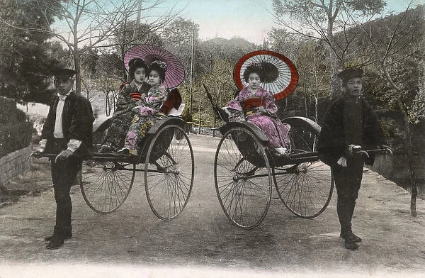 Japanese women transported by rickshaw
