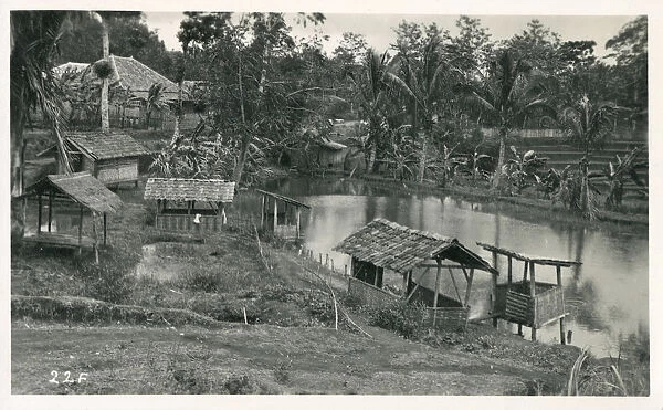 Java, Indonesia - Small shelters on the riverbank