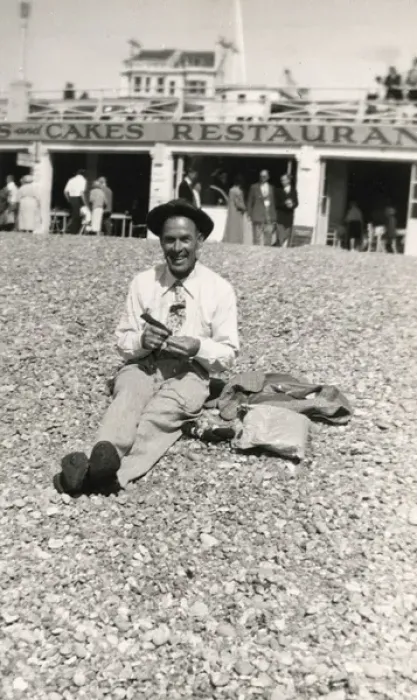 Framed Print : Jolly British gent sitting on beach in front of a restaurant Framed Print : Jolly British gent sitting on beach in front of a restaurant