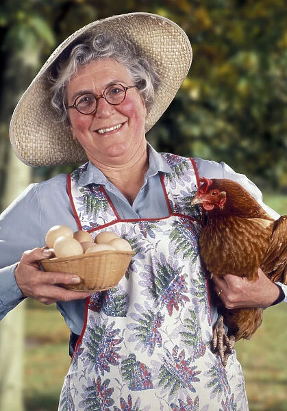 Jolly farmers wife with hen and eggs